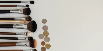Assortment of clean and dirty makeup brushes highlighting the importance of proper hygiene for beauty tools.