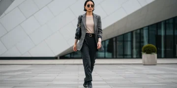 Woman confidently showcasing evolving personal style in urban setting