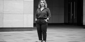 Petite woman in flattering high-waisted outfit